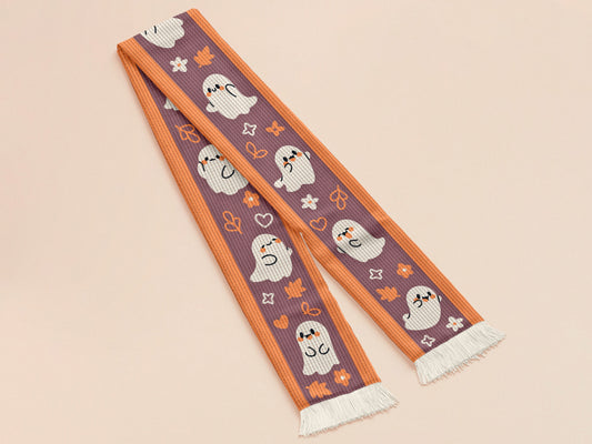 Cute knitted cotton scarf with fringe details and an autumn ghost themed pattern 
